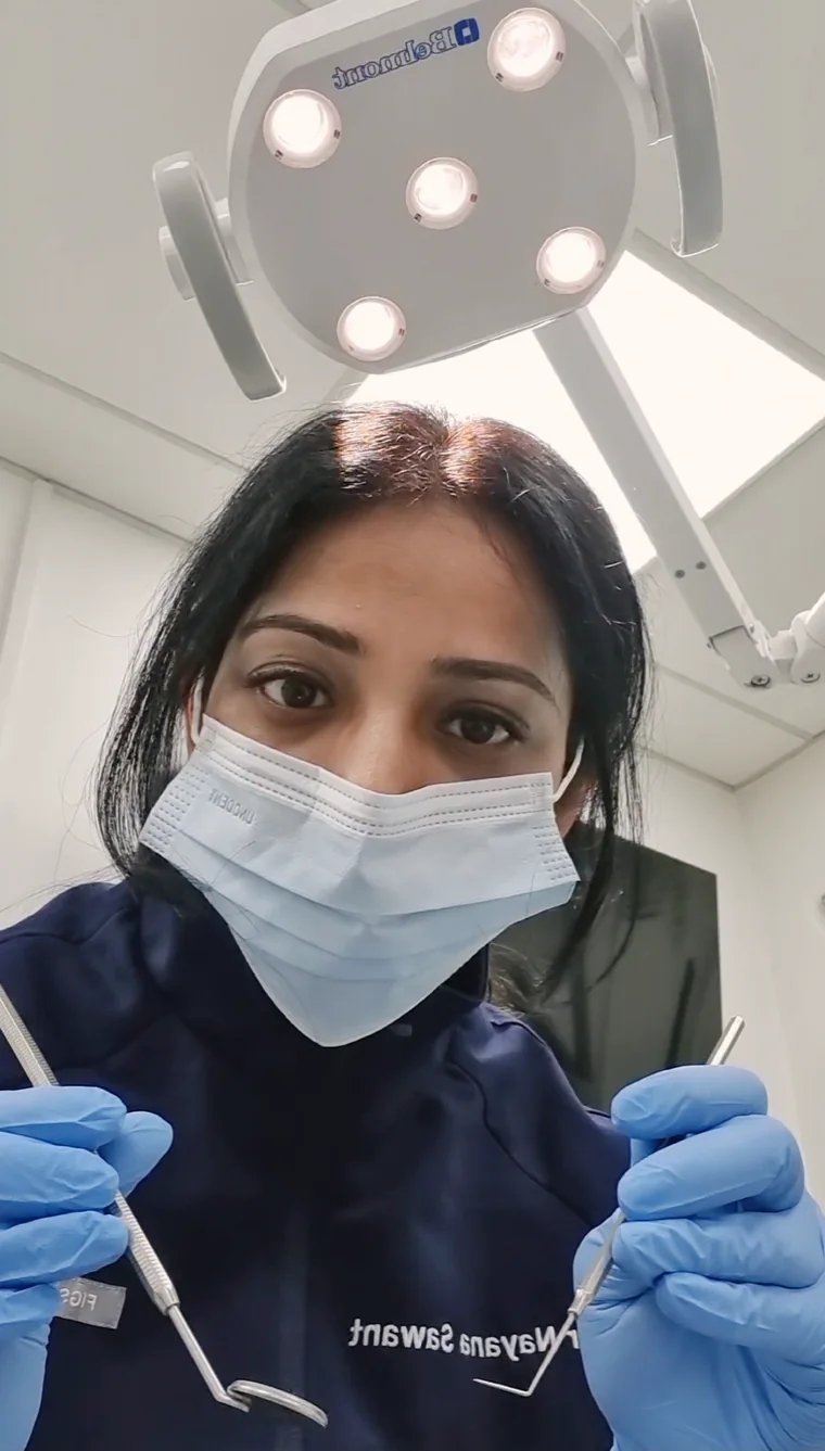 Dr Sawant ready to begin treatment, seen from the dental chair